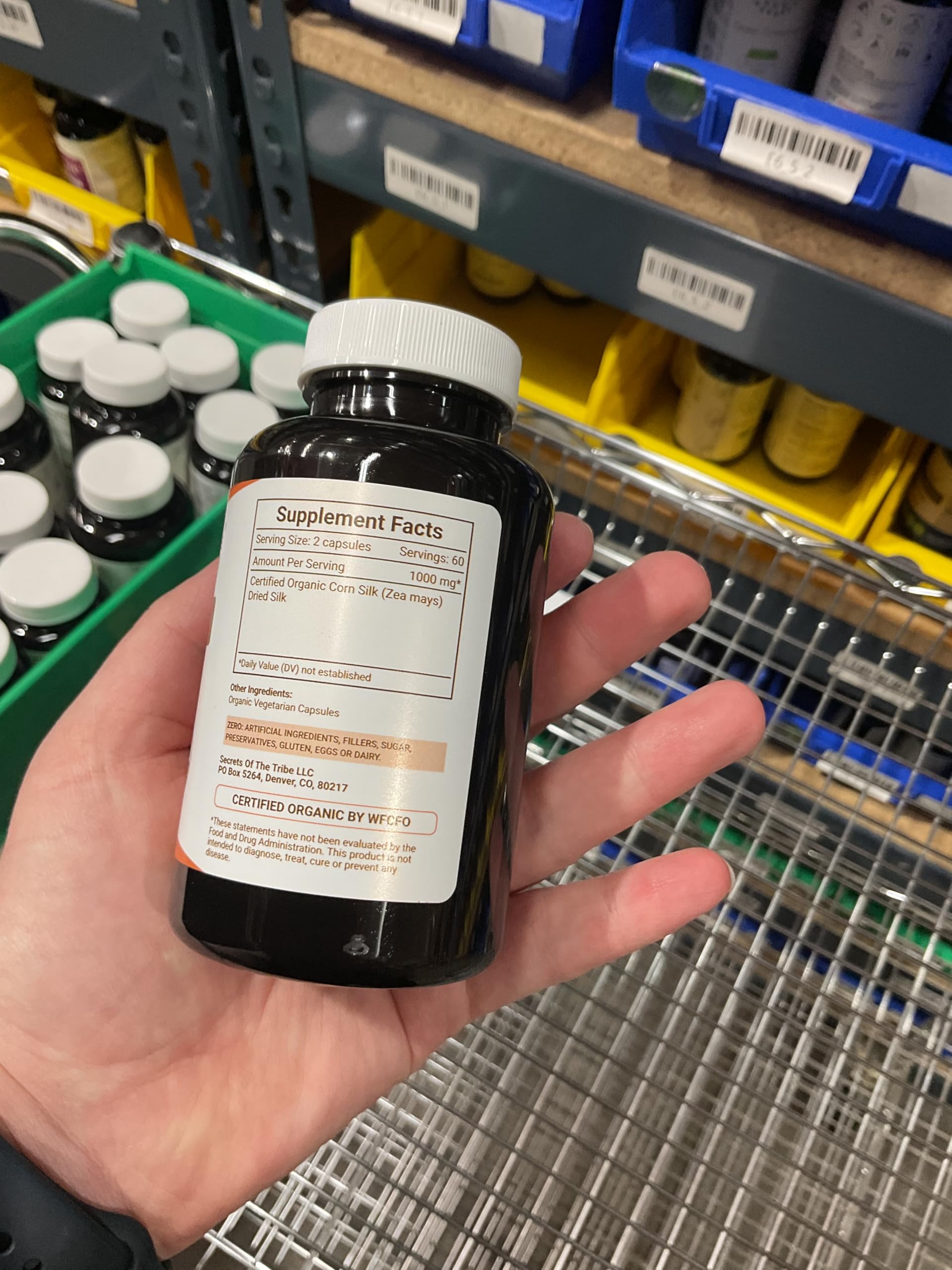 Secrets of the Tribe Corn Silk vegetarian capsules close-up emphasizing plant-based option.