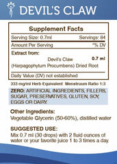 Secrets of the Tribe Devils Claw tincture pour on a spoon for convenient dosing.