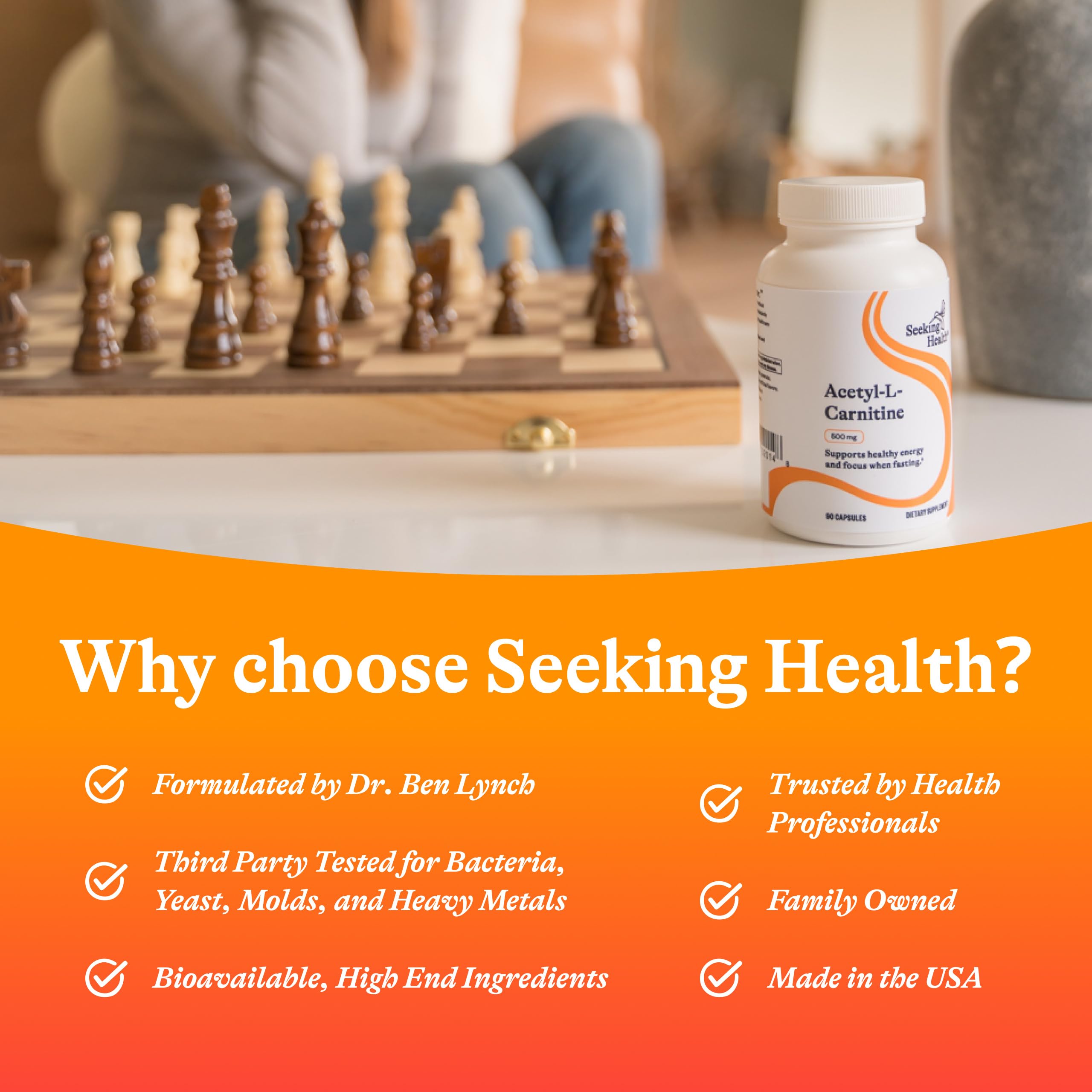 In-hand shot of Seeking Health Acetyl-L-Carnitine bottle for daily routine