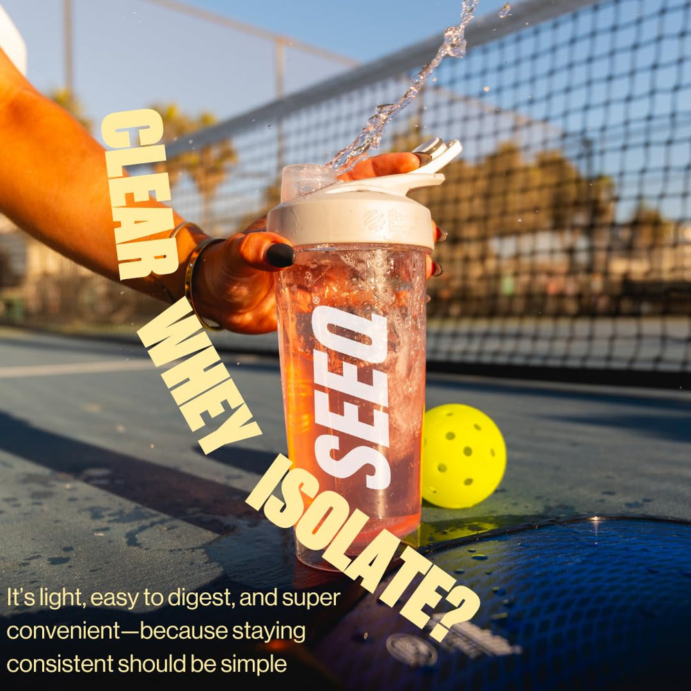 SEEQ Clear Whey Isolate Mango Pineapple bottle beside a glass after workout