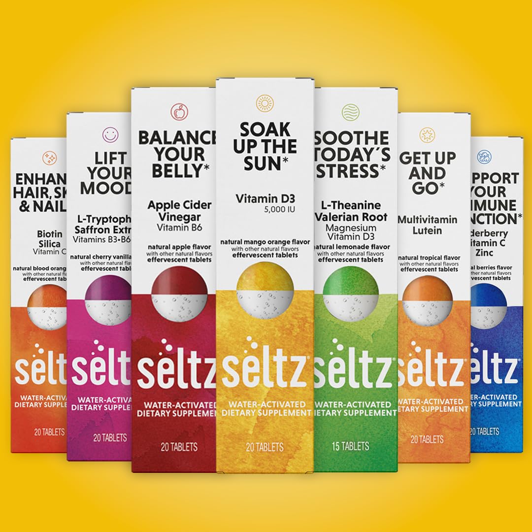 Seltz Soak Up The Sun on-the-go use dissolving in water at a desk.