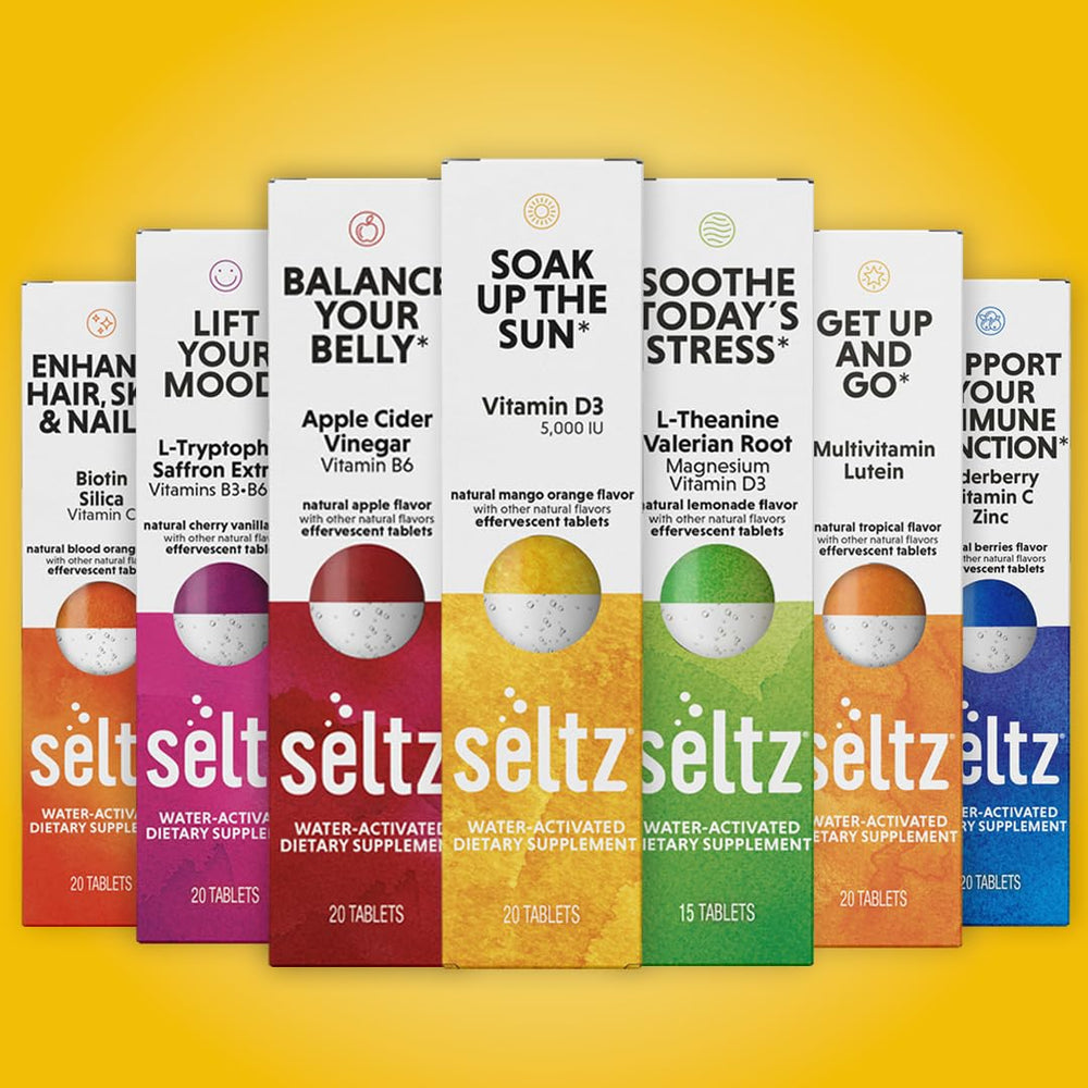 Seltz Soak Up The Sun on-the-go use dissolving in water at a desk.