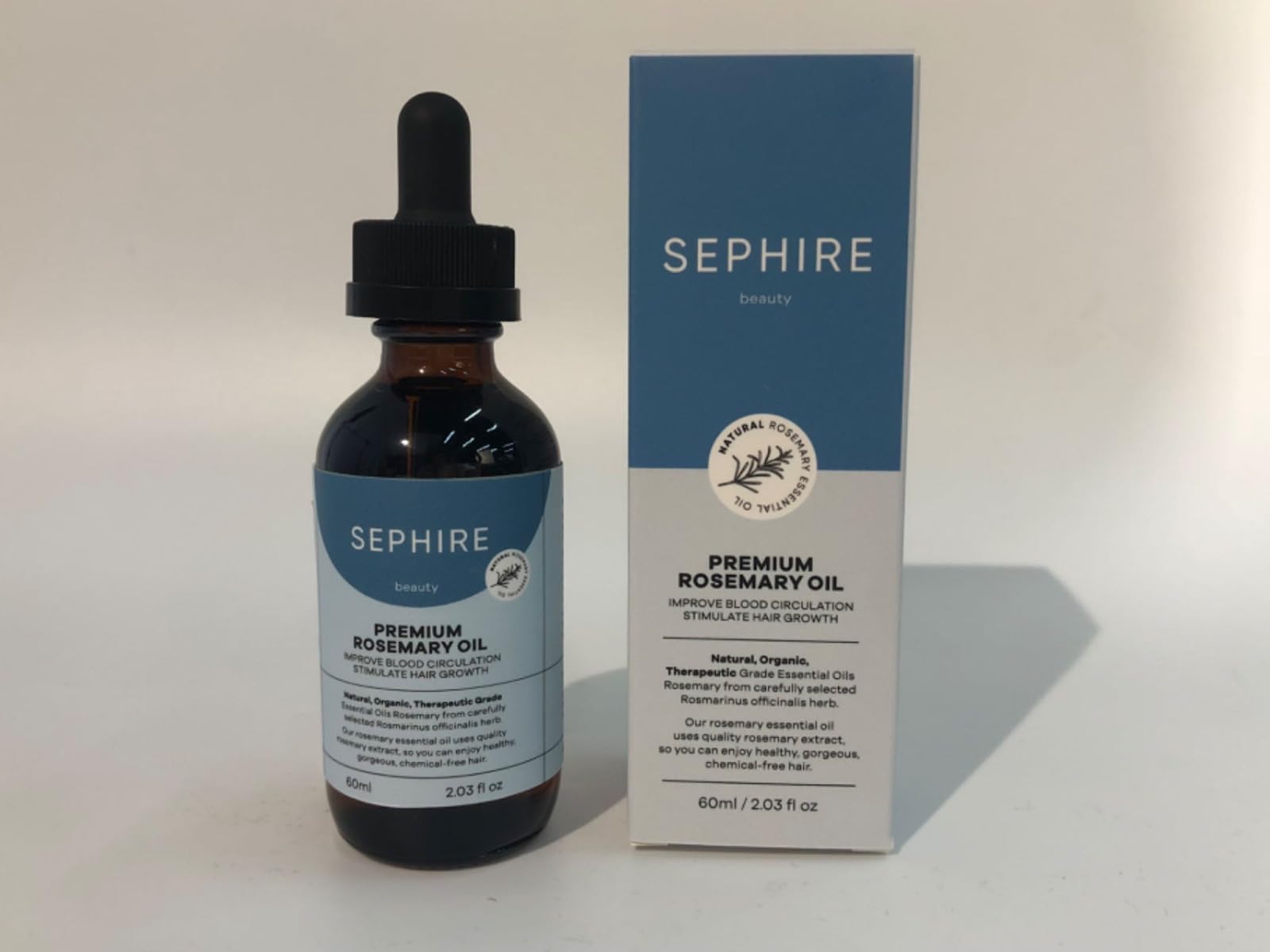Sephire Rosemary Oil bottle pour for daily use and purity.