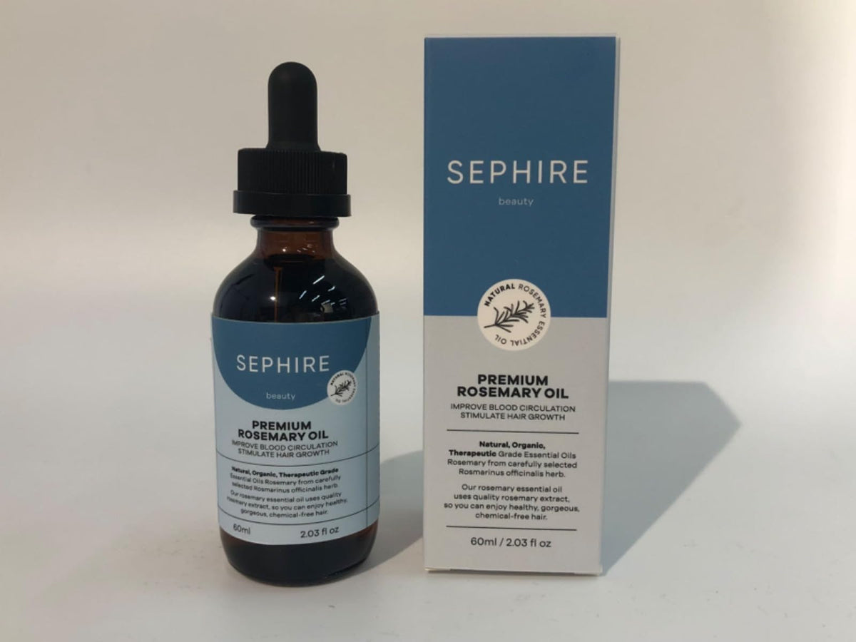 Sephire Rosemary Oil bottle pour for daily use and purity.