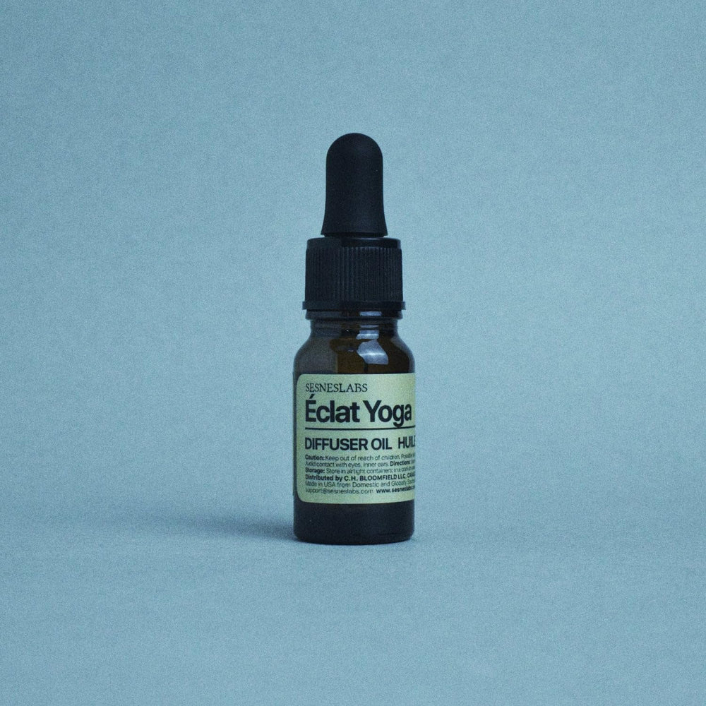 sesneslabs Éclat Yoga Diffuser Oil setup creates a tranquil yoga space.
