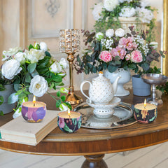 Seven Moons candle jar with floral-pattern lid, a soothing aesthetic.