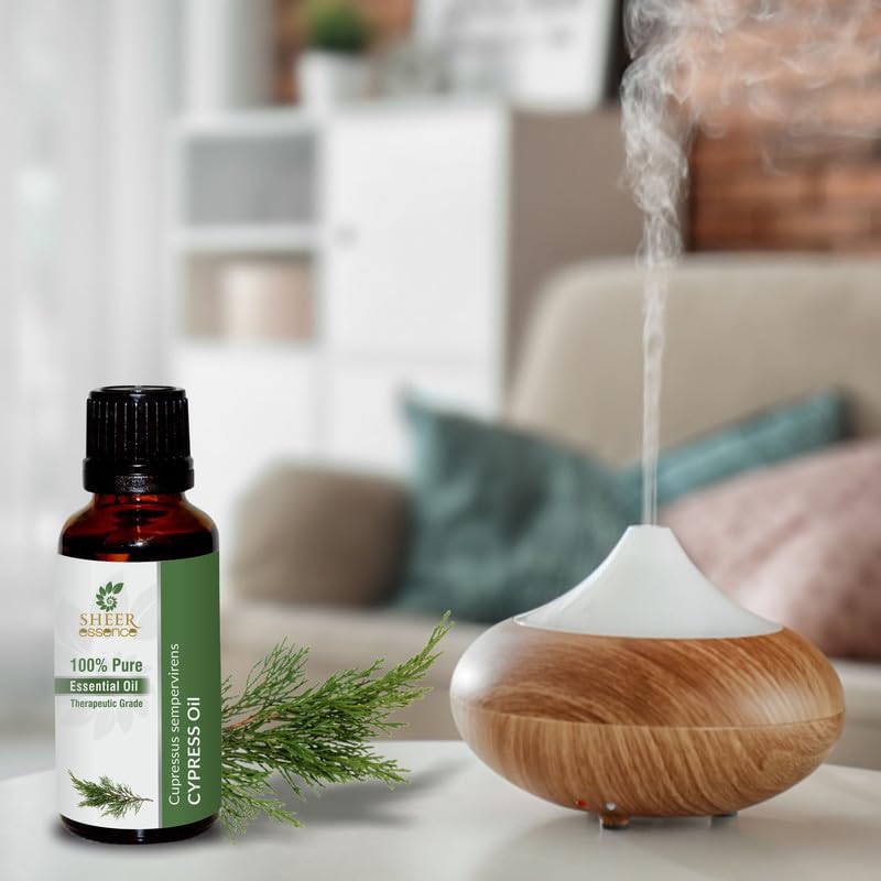 Sheer Essence Cypress Oil candle crafting with evergreen notes.