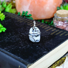 Shelf and Stone Rainbow Moonstone pendant showing its 1-1/2 by 1 inch size.