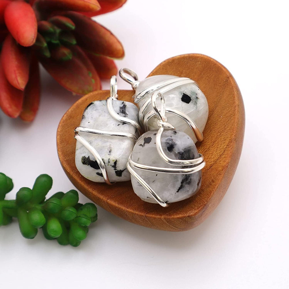 Shelf and Stone Rainbow Moonstone pendant with black tourmaline accent for grounding contrast.