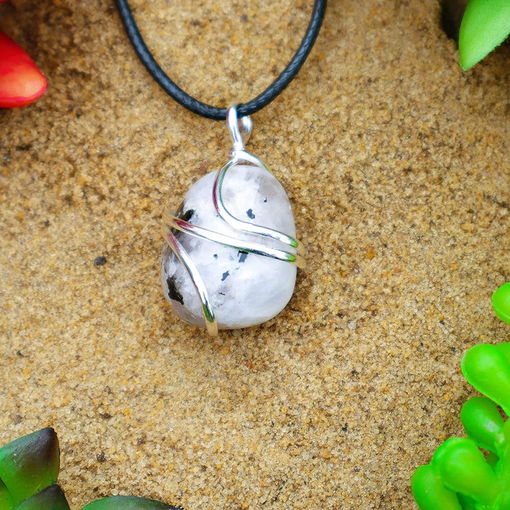 Shelf and Stone Rainbow Moonstone in handcrafted wire wrapped setting detail.