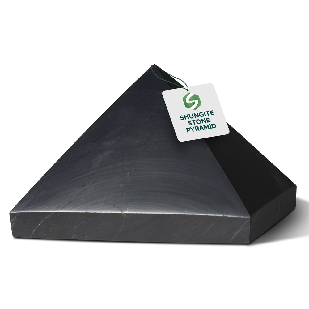 Shungite World authentic pyramid 30mm top view enhances desk energy balance and focus.