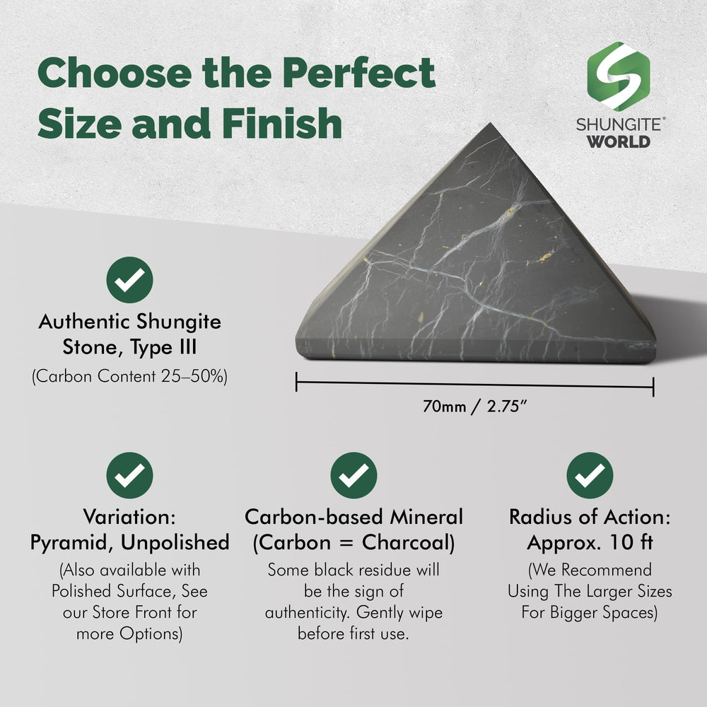 Shungite World 70mm pyramid in a cozy desk setup for focus