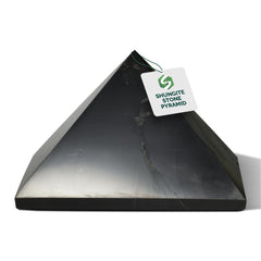 Shungite World polished 80mm pyramid close-up highlighting glossy surface for focus and decor.