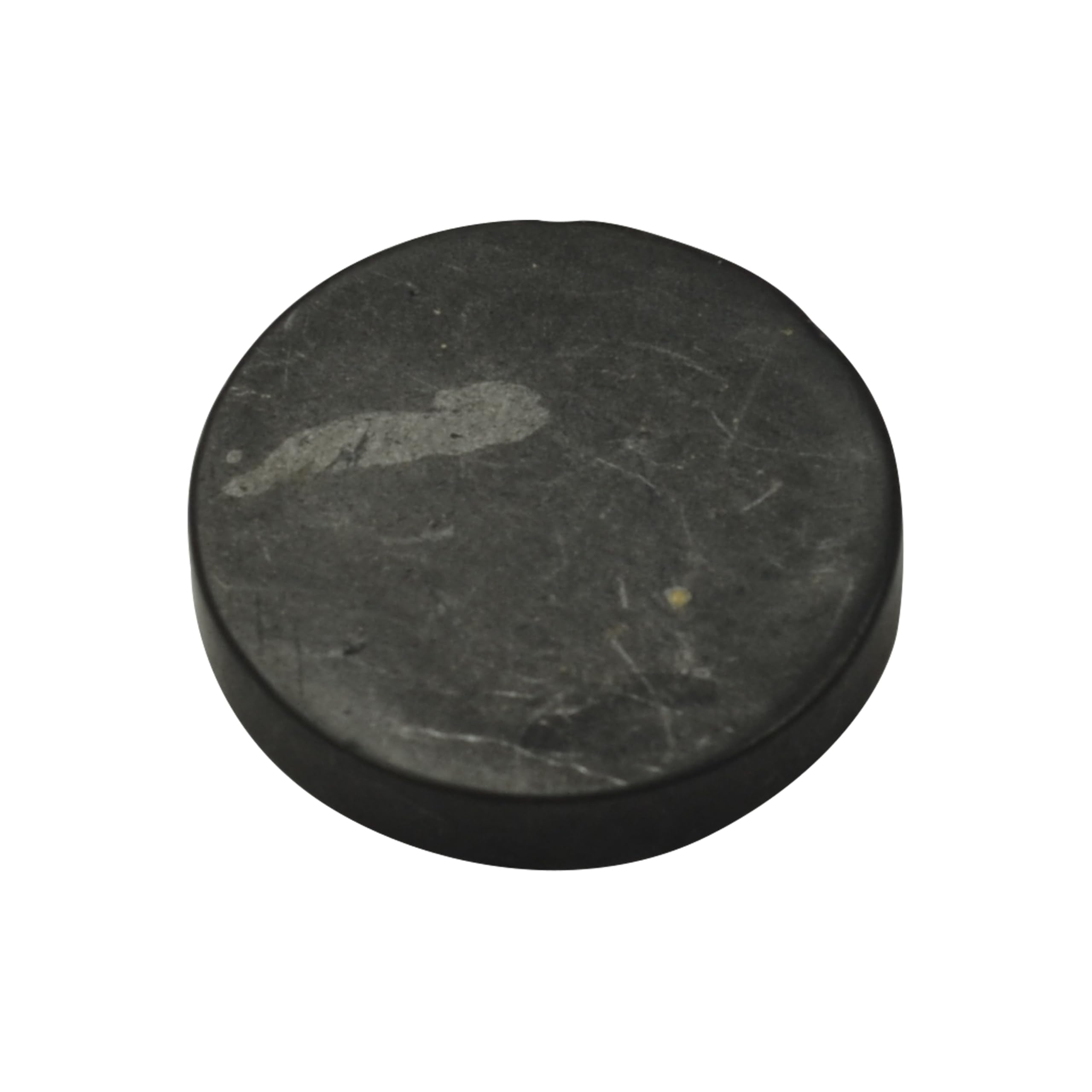 Shungite World authentic 40mm sticker on a device surface showing grounding energy.