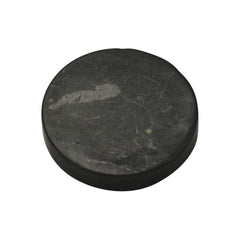 Shungite World authentic 40mm sticker on a device surface showing grounding energy.