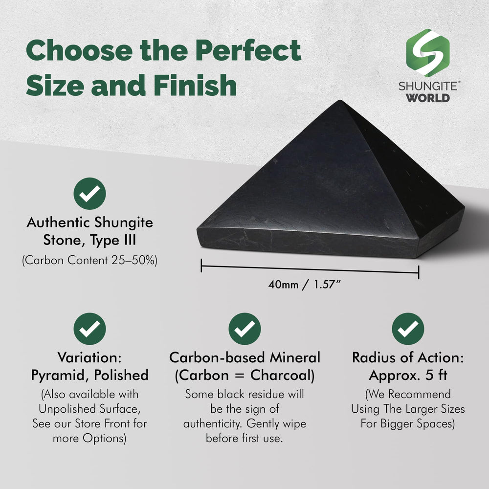 Shungite World pyramid on desk paired with devices for energy balance