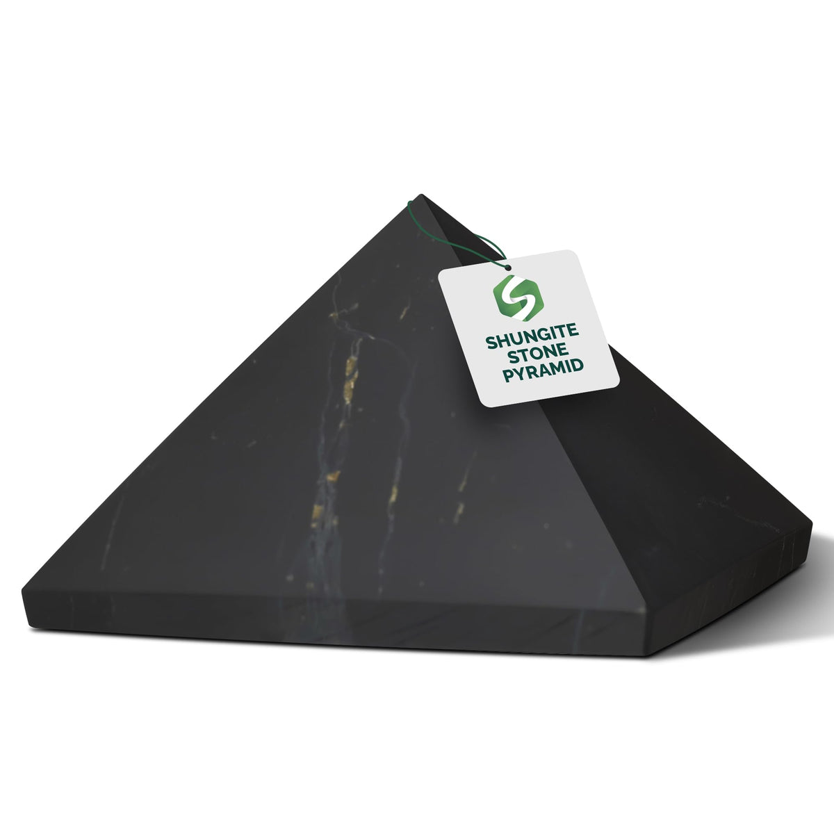 Shungite World Shungite Pyramid 40mm on desk for grounding and focus.