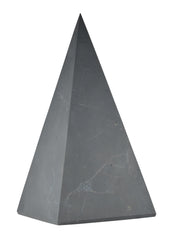 Shungite World tall pyramid unpolished 100mm on display for calm energy balance.