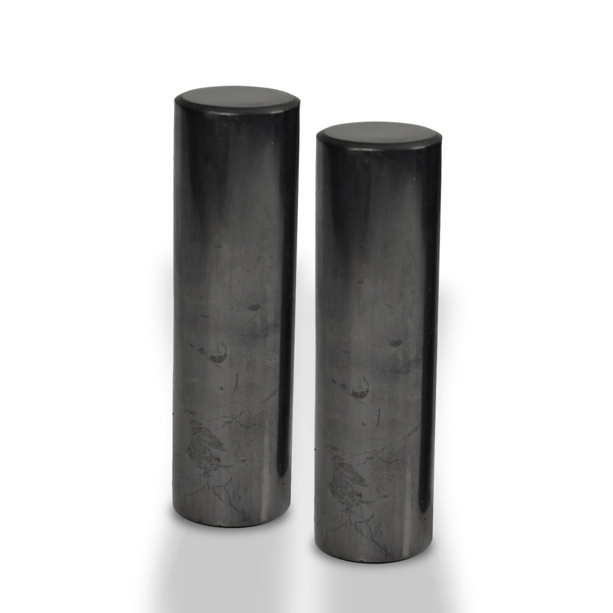 Shungite World two polished cylinders for grounding during meditation.