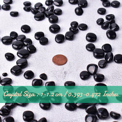SigMntun obsidian crystal stones hand-held for tactile use and focus.