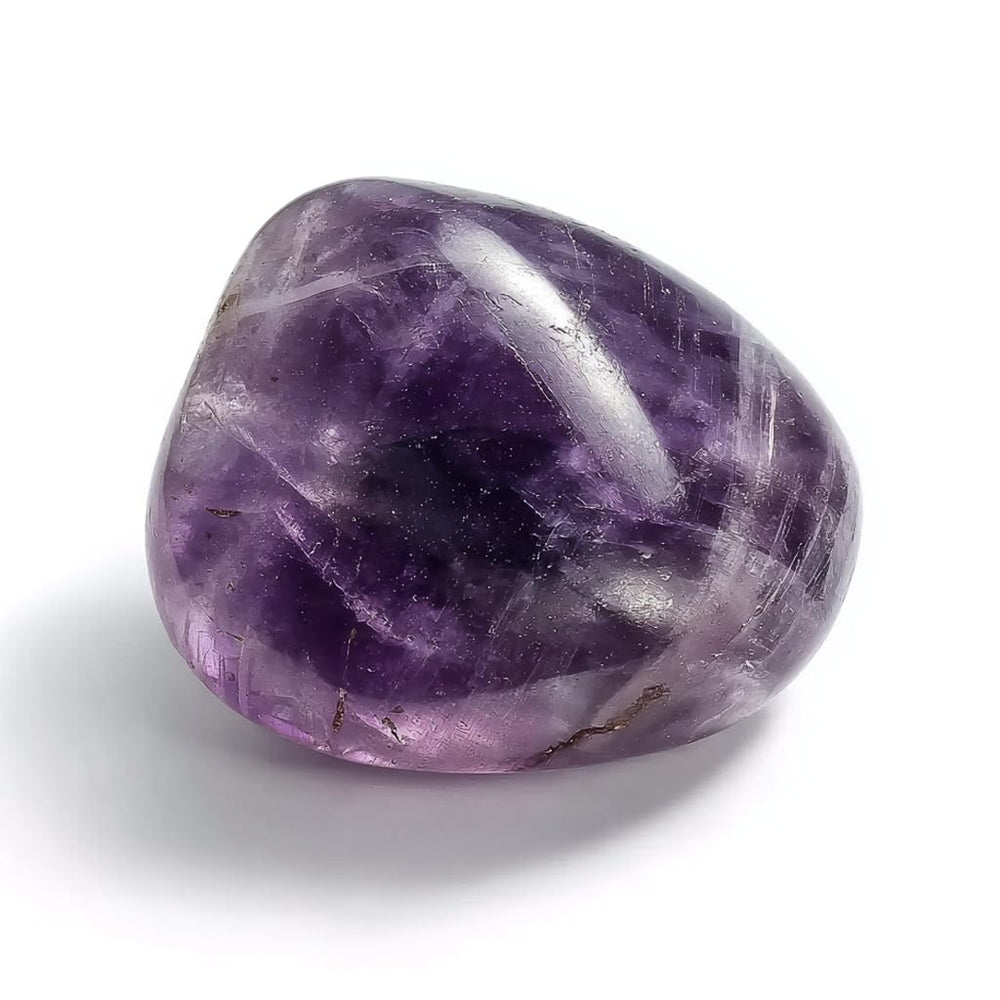 SigMntun polished amethyst worry stone held in hand for calm focus.