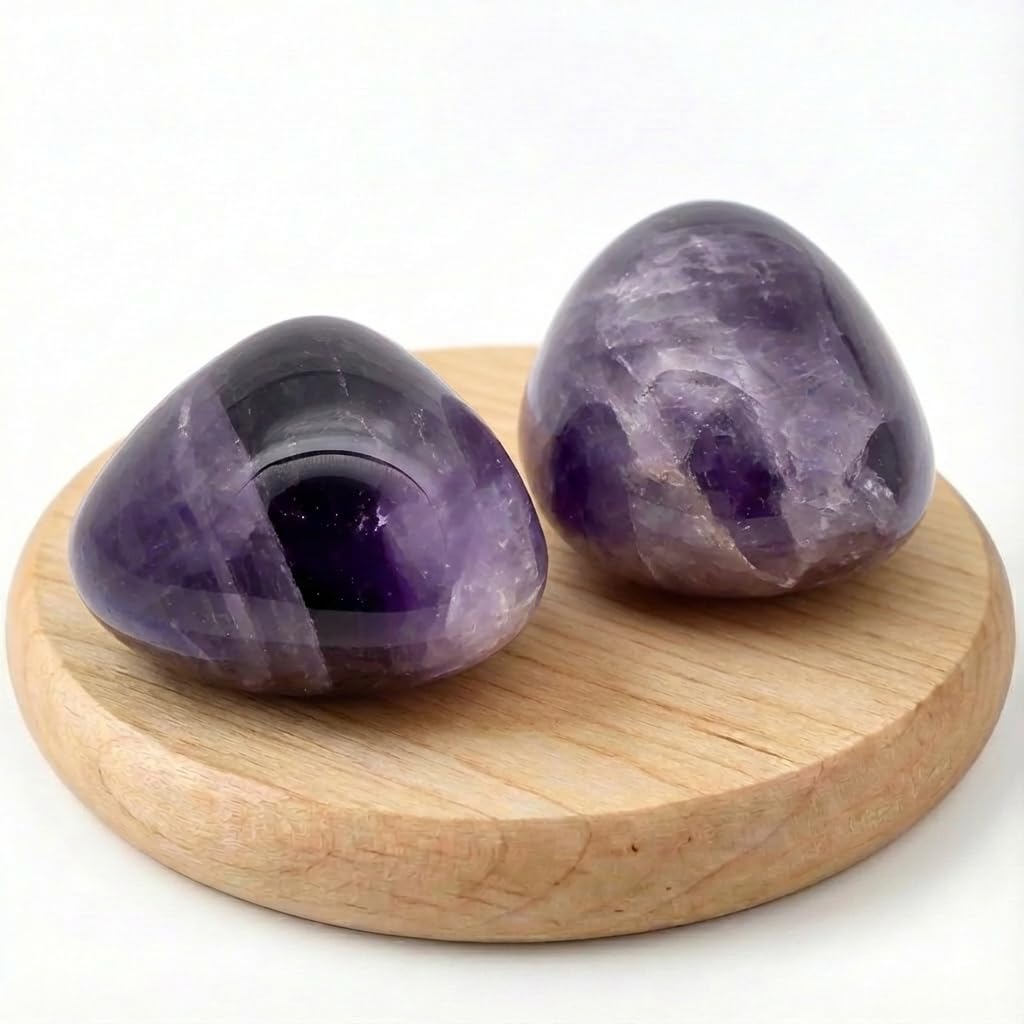 SigMntun amethyst worry stone held in hand for grounding and calm practice.