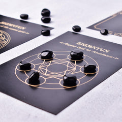 SigMntun obsidian crystals set on desk for calm ambiance and decoration.