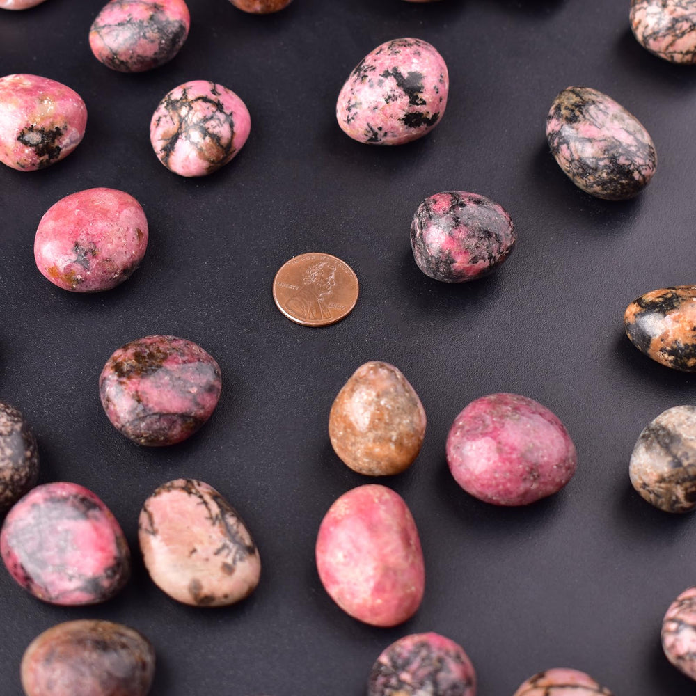 SigMntun Rhodonite crystals for Reiki and chakra-focused sessions.