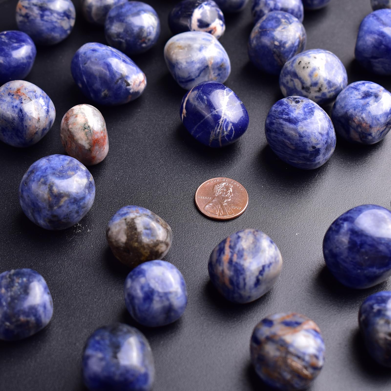 SigMntun sodalite polished stone pile shown as decorative display