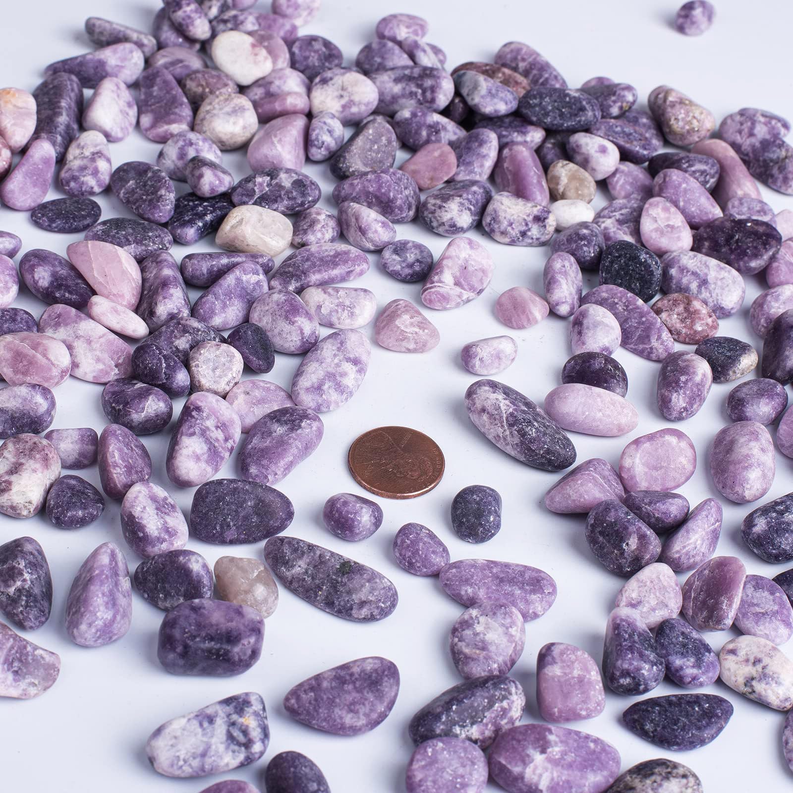 SigMntun handpicked tumbled Lepidolite pebbles suitable for Reiki practice.