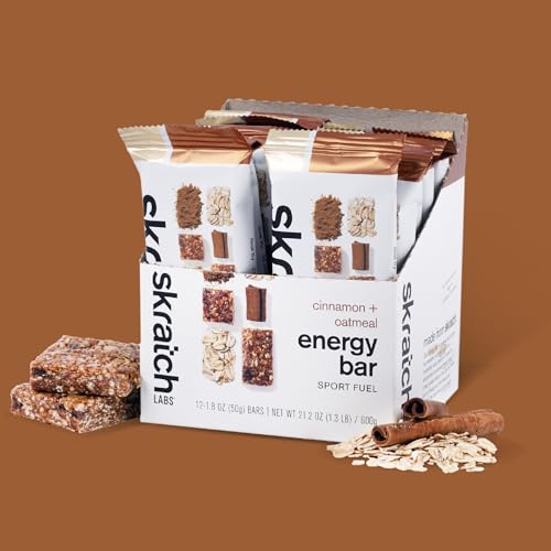 Skratch Labs Energy Bar Cinnamon Oatmeal bar in hand highlights portable nutrition for active days.