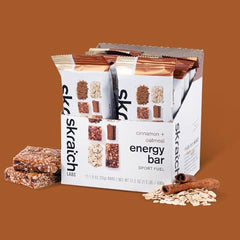 Skratch Labs Energy Bar Cinnamon Oatmeal bar in hand highlights portable nutrition for active days.