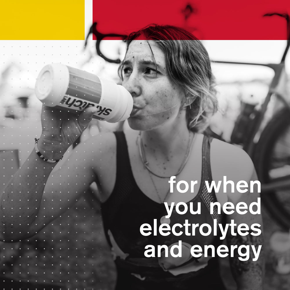 Runner sipping Skratch Labs Hydration Powder during a run.