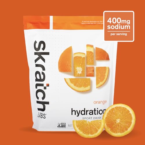 Skratch Labs Hydration Powder Orange dissolving in water to create a refreshing drink.
