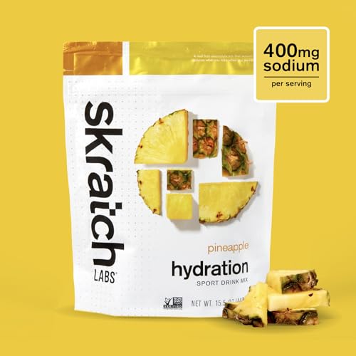 Skratch Labs Hydration Powder pineapple scoop beside bottle showing easy dosage.