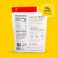 Skratch Labs Hydration Powder Strawberry Lemonade scoop-dispensing shows quick mix for on-the-go fueling.