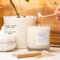 Slow North Midnight Garden essential oils blend in soft candlelight