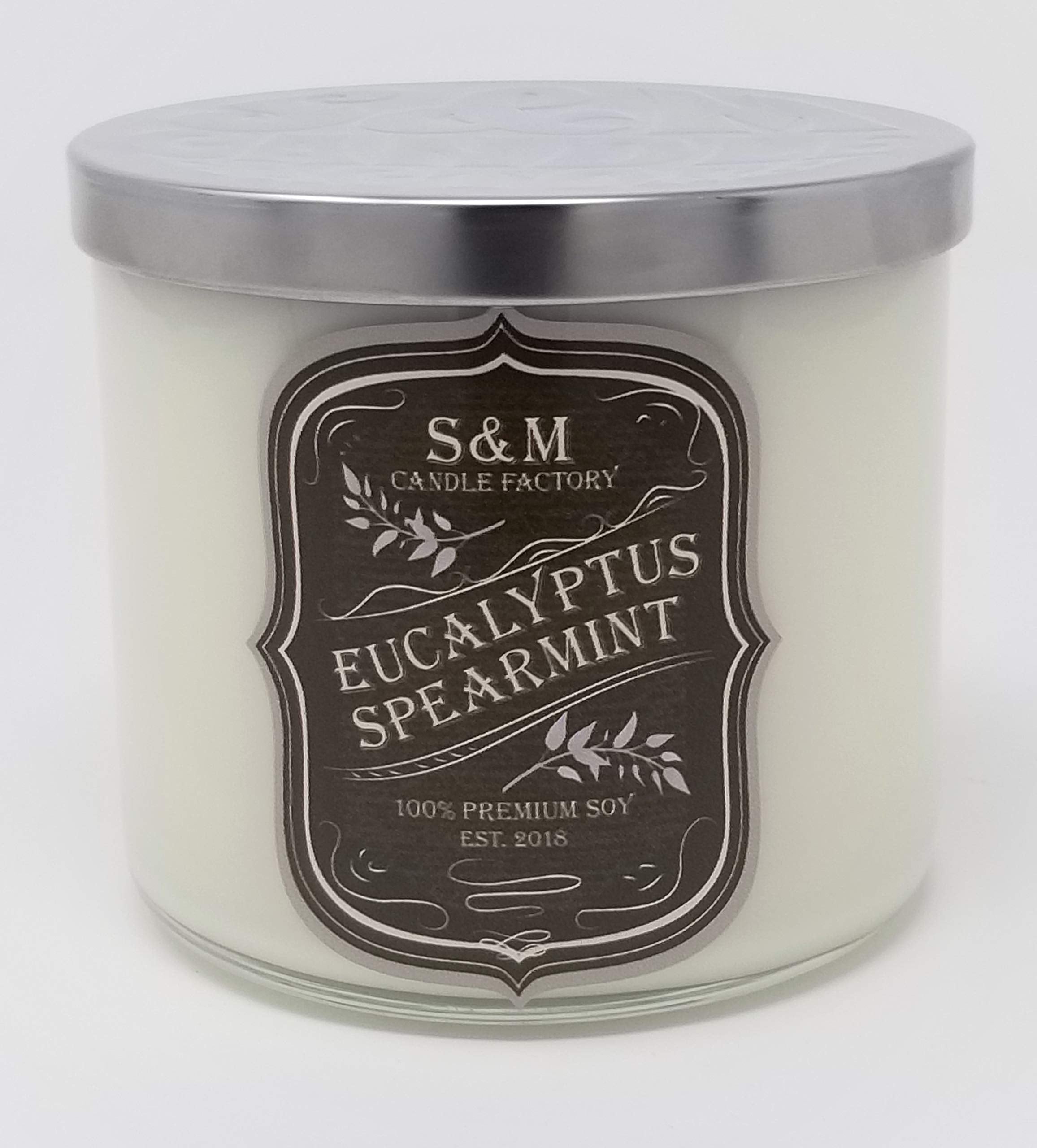 S&M Candle Factory Eucalyptus Spearmint candle in a large 3-wick jar creates a calming home ambience.