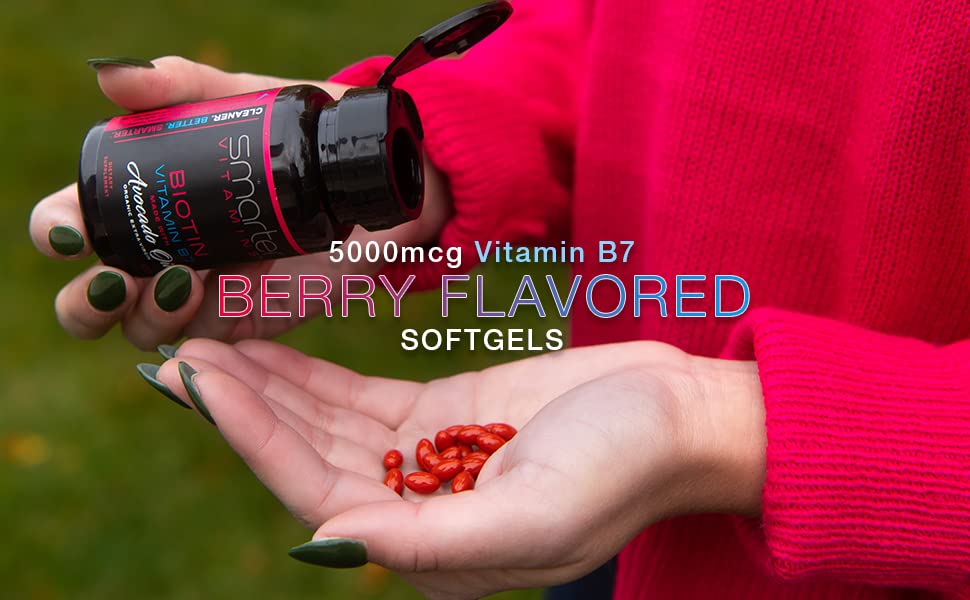 Close-up of SmarterVitamins Biotin softgels with avocado oil for easy swallowing.