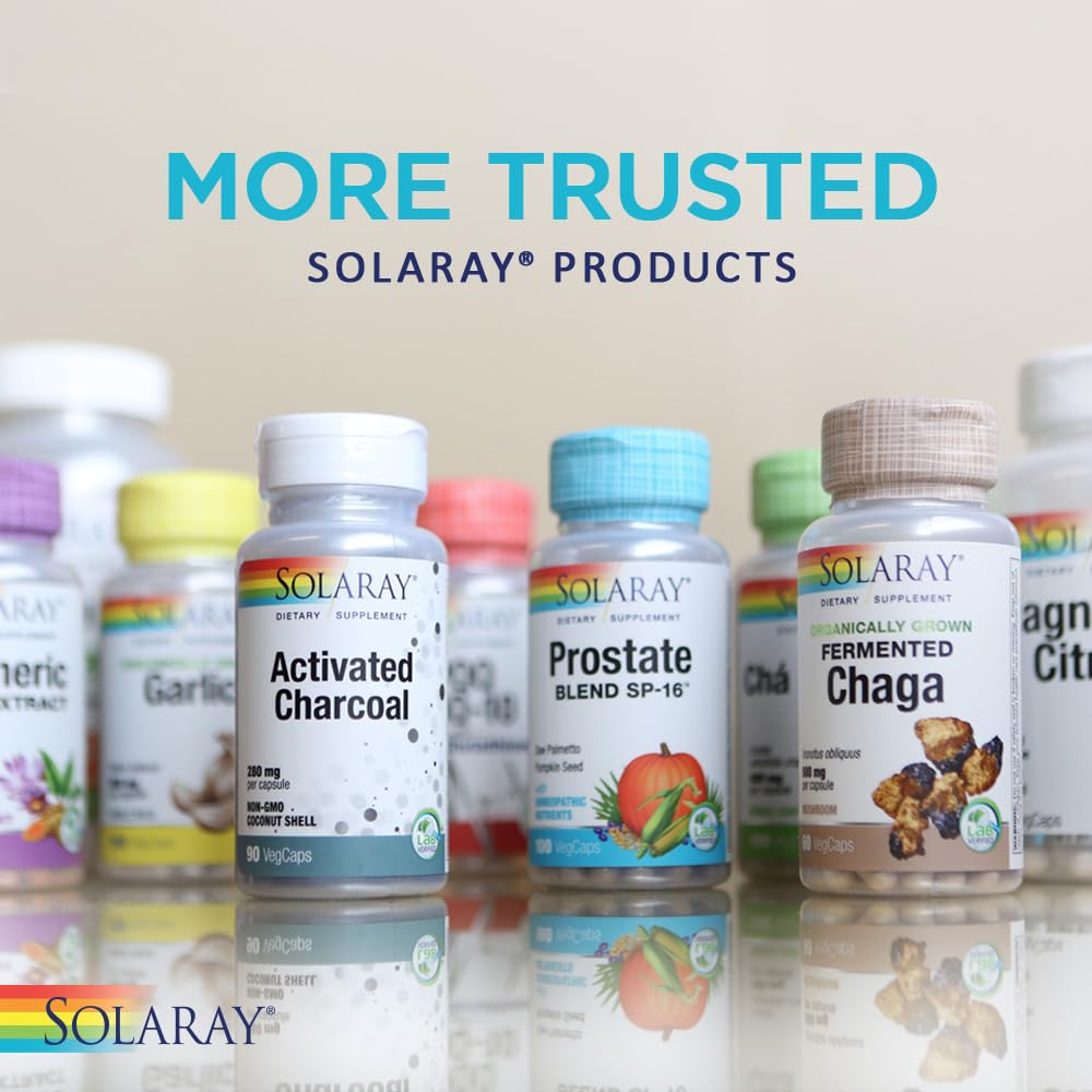 Serving scoop with SOLARAY capsules next to bottle for daily use