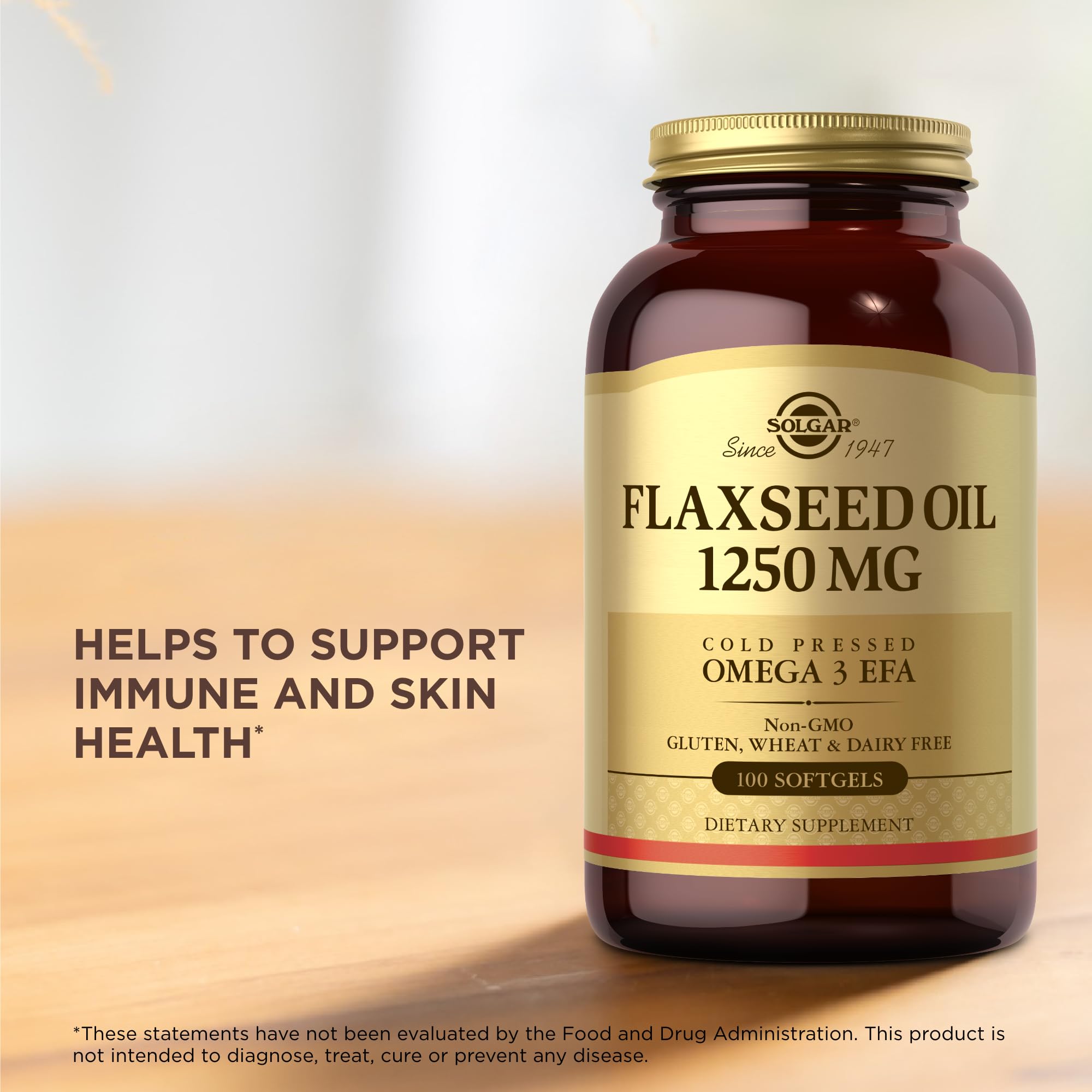 Solgar Flaxseed Oil softgels in hand, easy-to-swallow daily capsules.