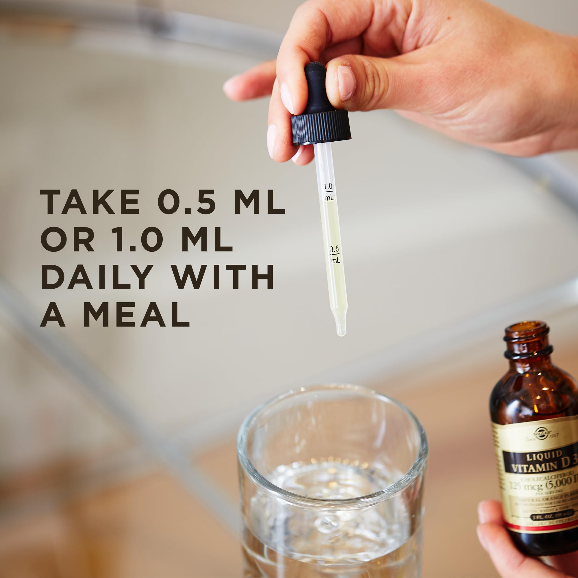 Solgar Liquid Vitamin D3 orange liquid closeup highlights natural flavor for daily supplementation.