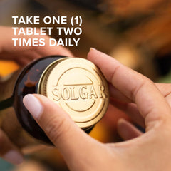 Tablets pouring from Solgar bottle suggesting easy daily use for joint wellness