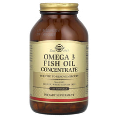 Solgar Omega 3 Softgel bottle beside a glass of water for daily routine.