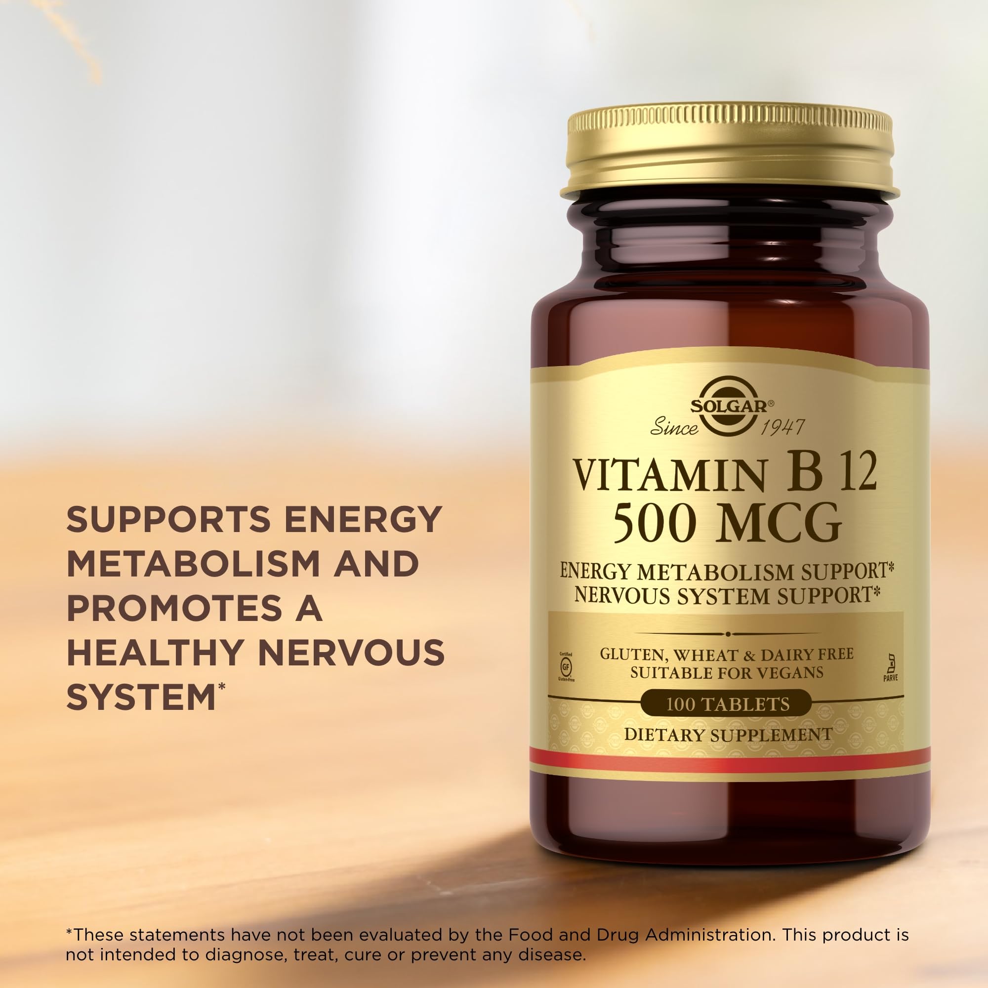 Solgar Vitamin B-12 500 mcg bottle beside a glass for daily use.