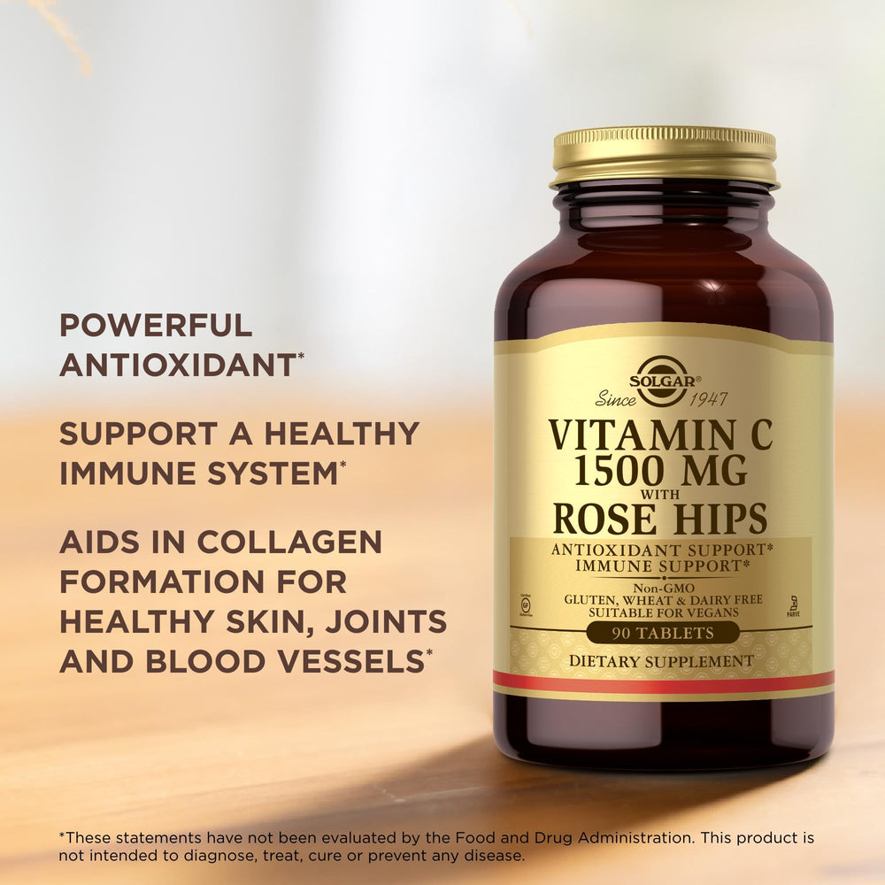 Solgar Vitamin C 1500mg with Rose Hips bottle beside a glass for daily intake