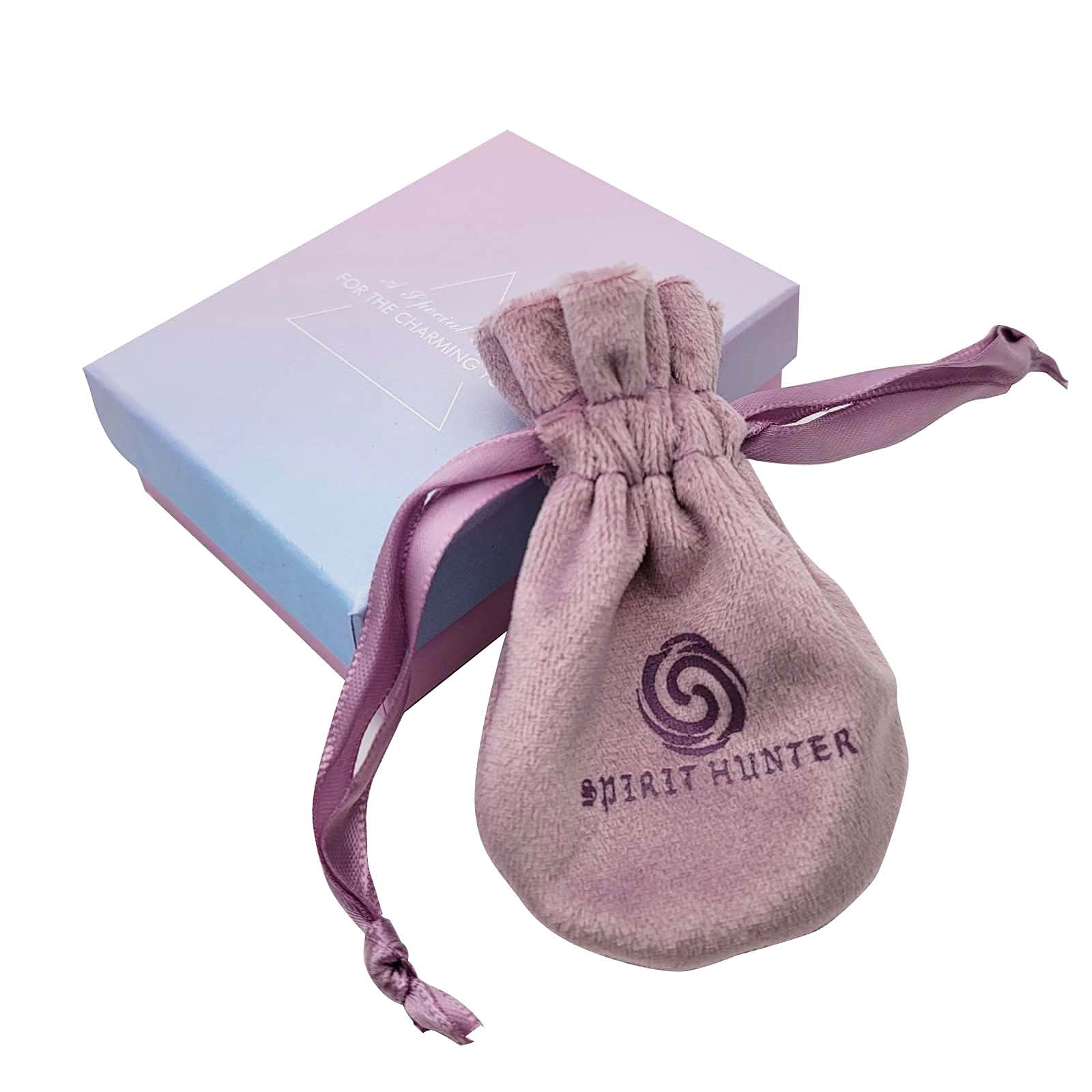 Spirit Hunter Goddess pendulum resting in velvet pouch for safe storage.