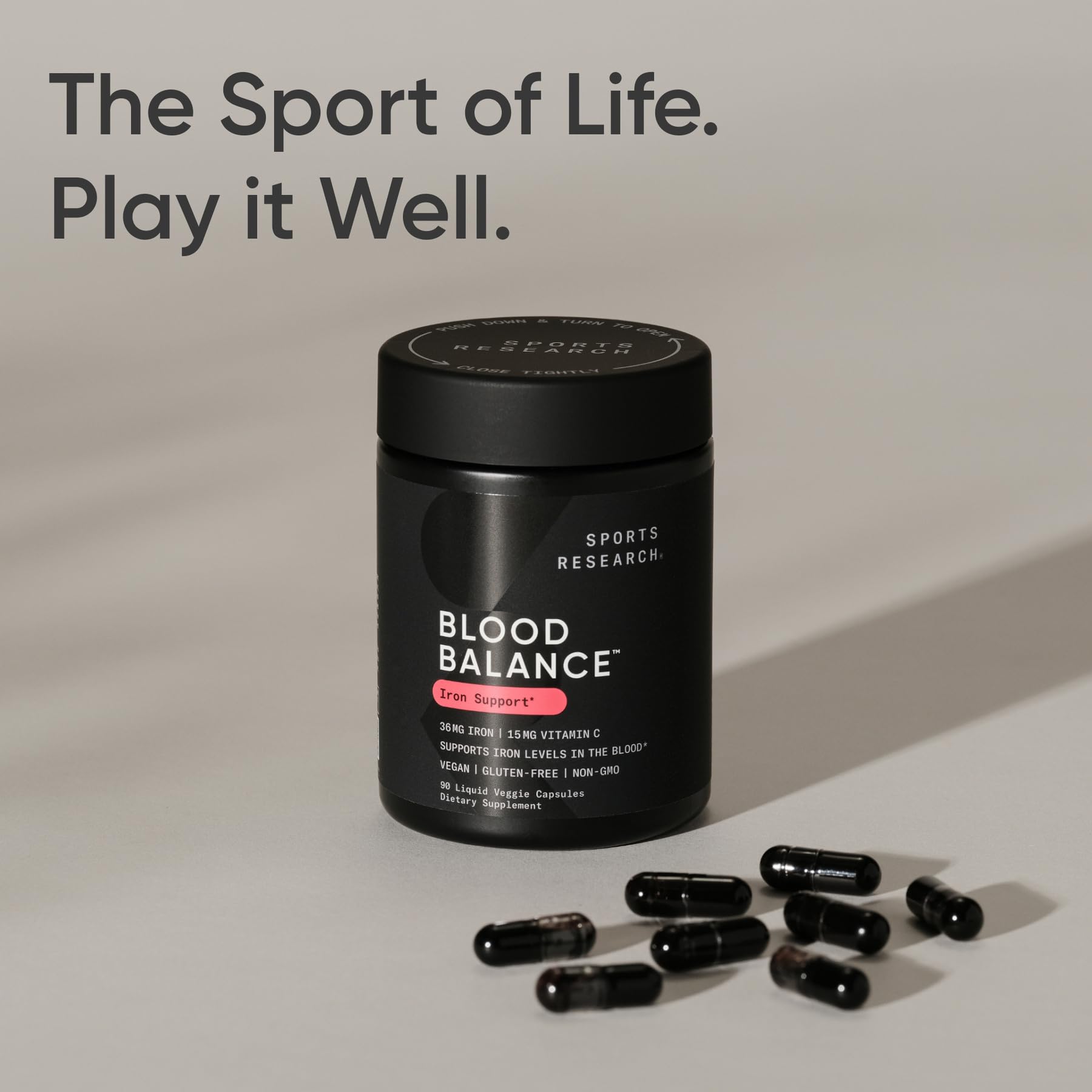Sports Research Blood Balance bottle with a glass, implying a simple daily dosing ritual
