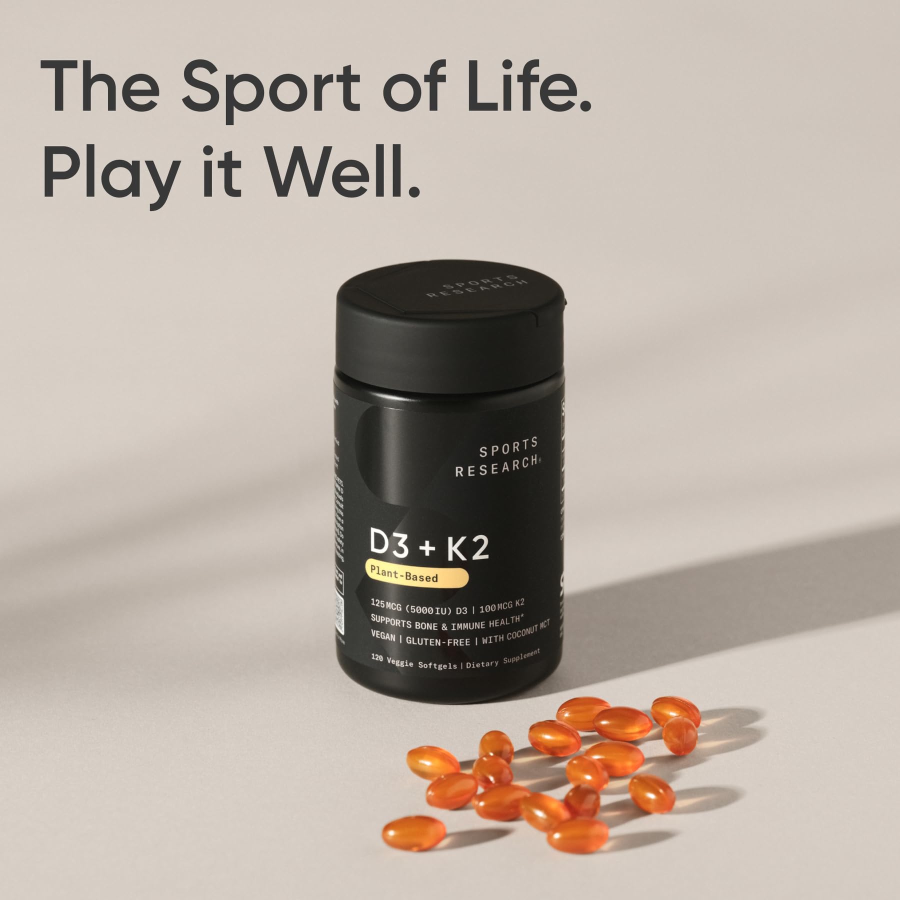 Sports Research daily dose softgels on table, ready for a routine.