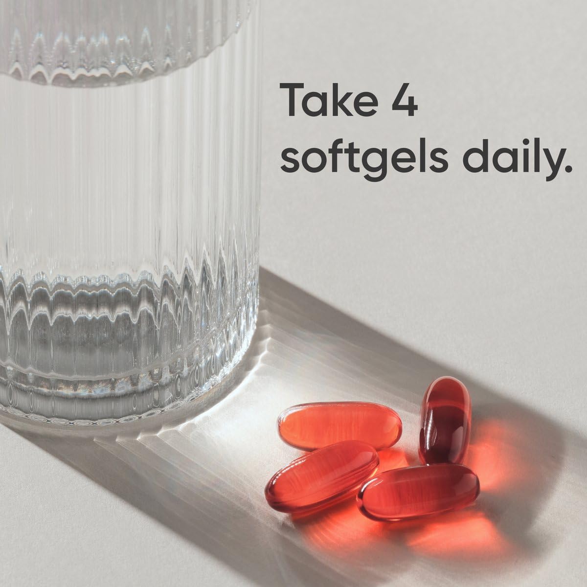 Sports Research Keto Omega softgels close-up, easy-to-swallow fish oil capsules.